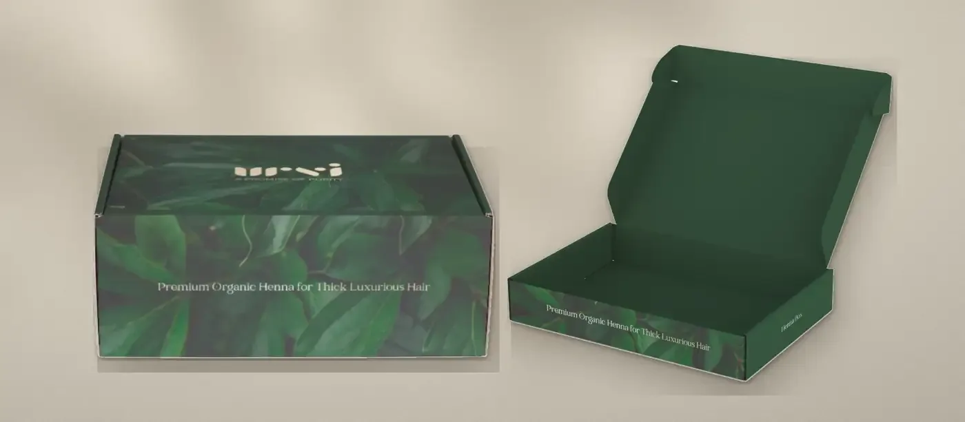 Closed and open Urvi Henna Box mailer boxes wrapped in deep green leaf photography