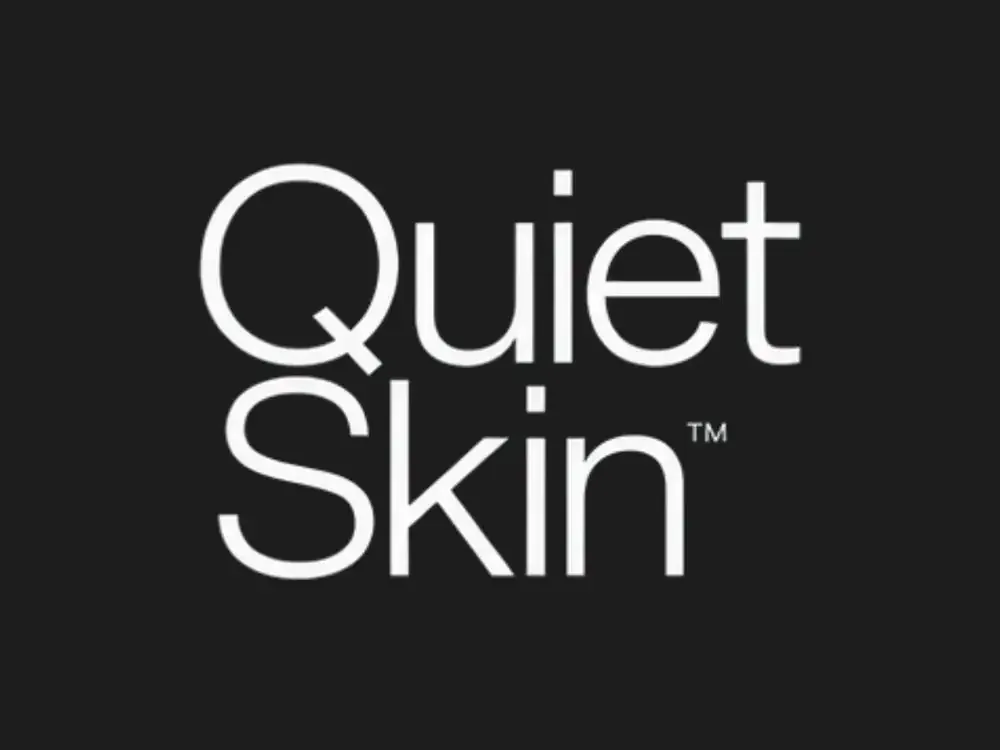 Quiet Skin wordmark in white on charcoal