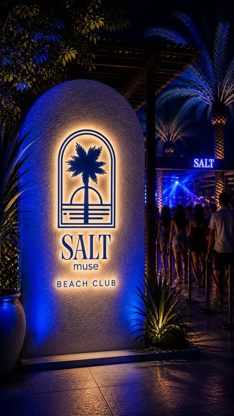 Salt Muse beach club sign at night