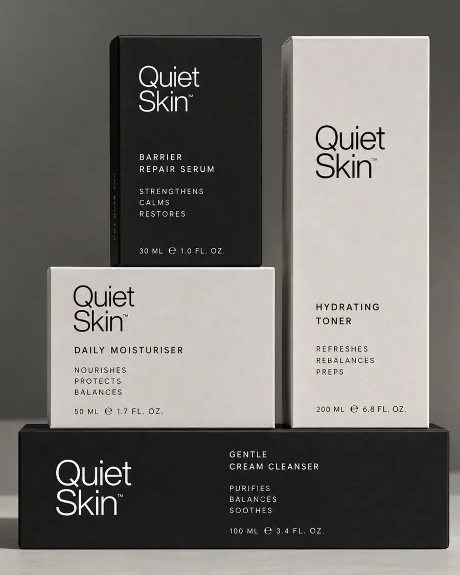Stacked black and white Quiet Skin product cartons