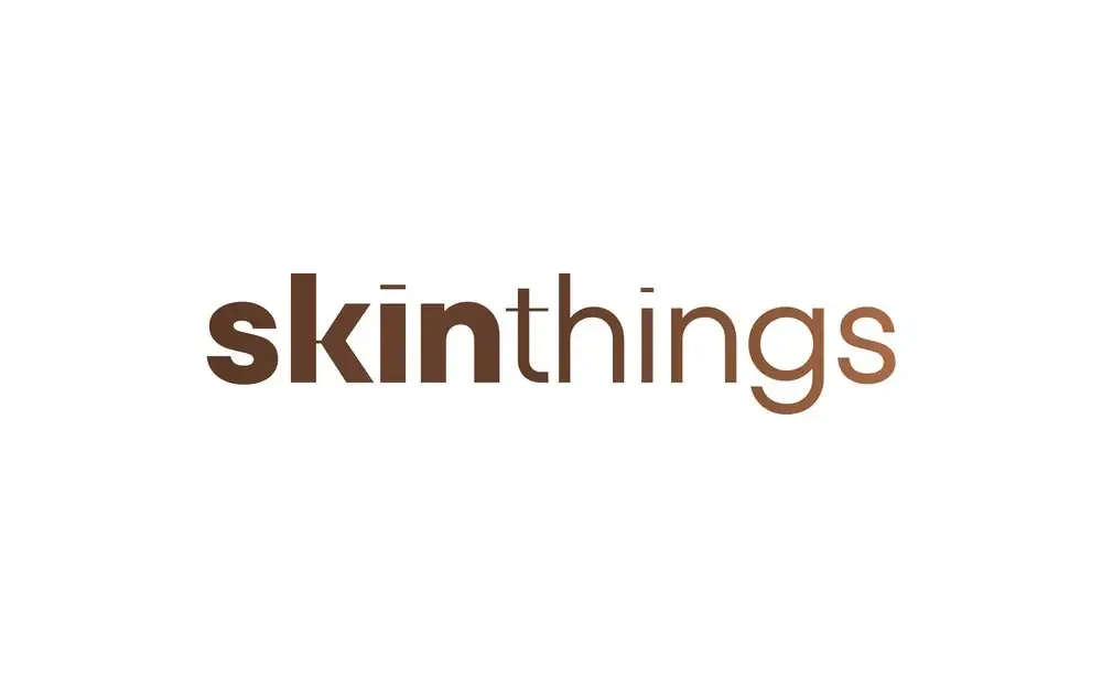 Skinthings wordmark in a chocolate-to-tan gradient on white