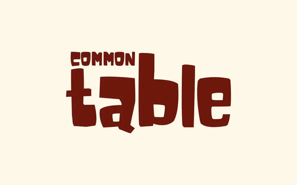 Common Table wordmark in burgundy on cream